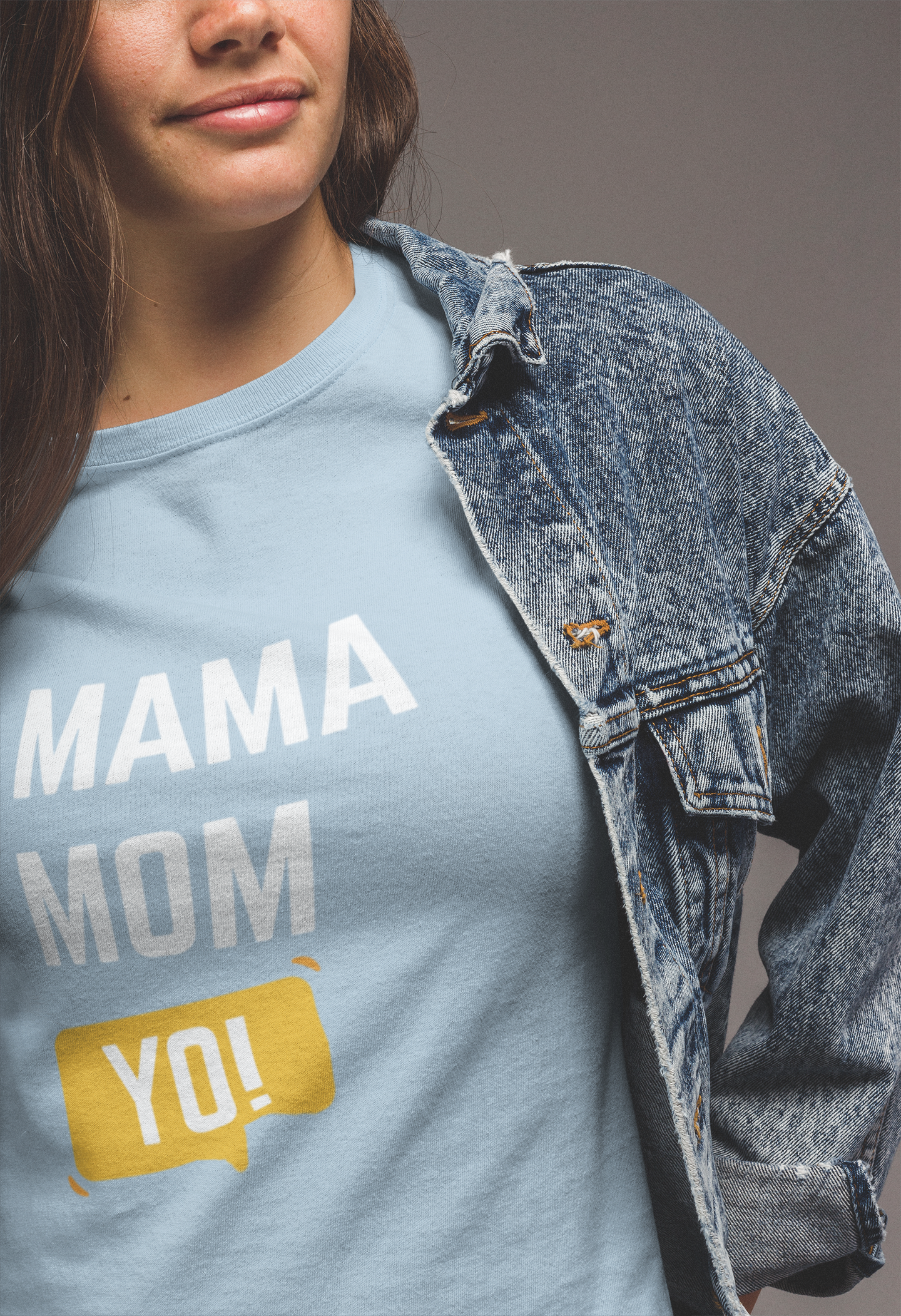 Light‑blue mom life shirt featuring “Mama Mom Yo!” text styled beneath a denim jacket for everyday wear.