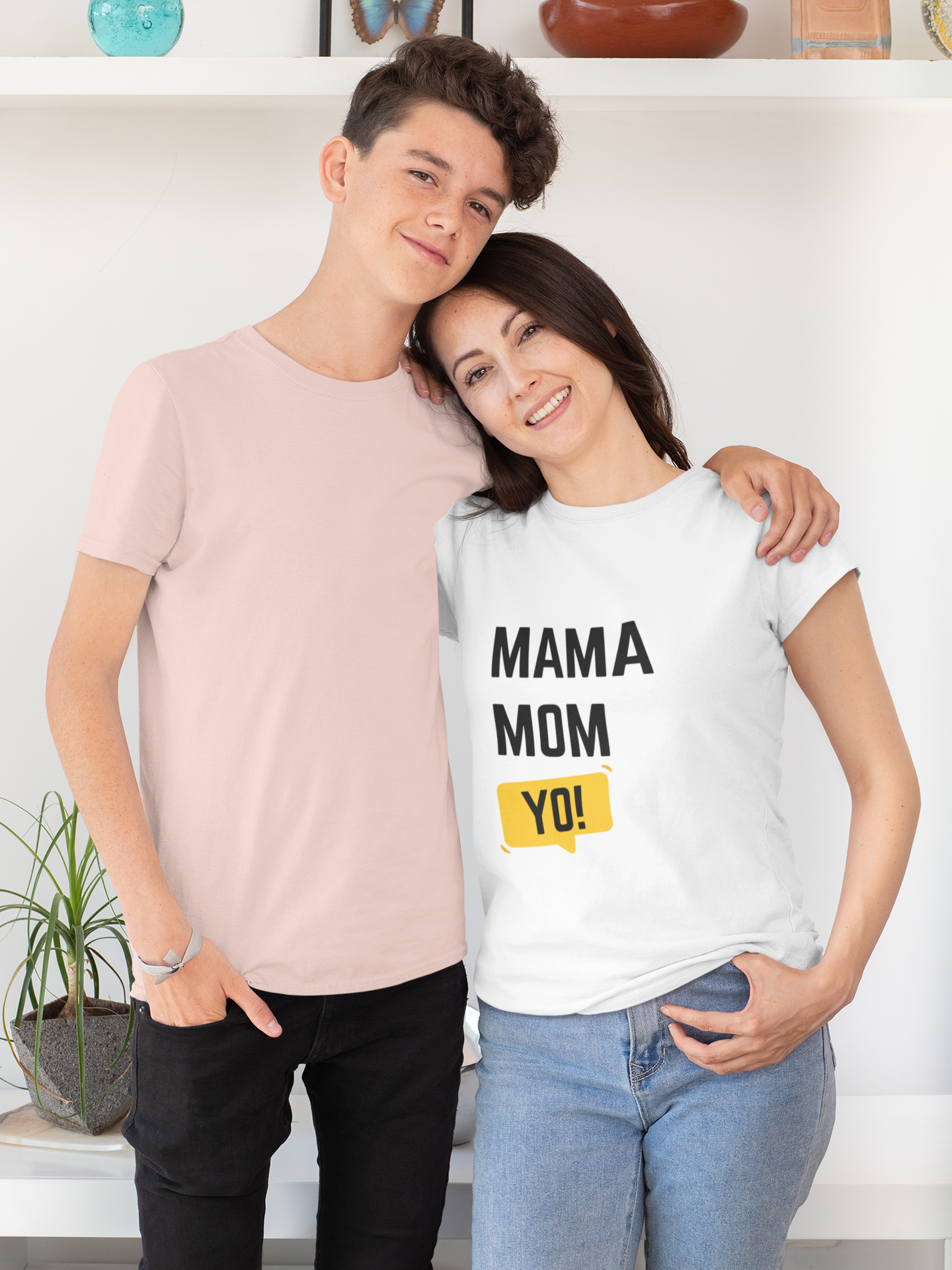 Smiling mom wearing white “Mama Mom Yo!” design, perfect example of stylish mom shirts for Mother’s Day.