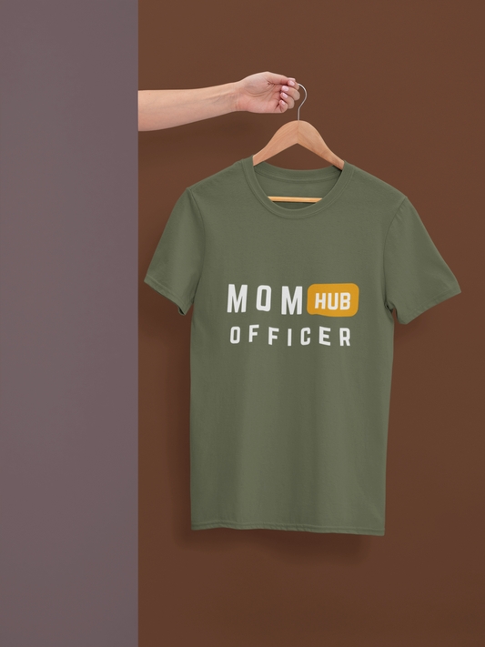 Mom Hub Officer” mom life shirt neatly displayed on hanger against brown wall for easy gifting.