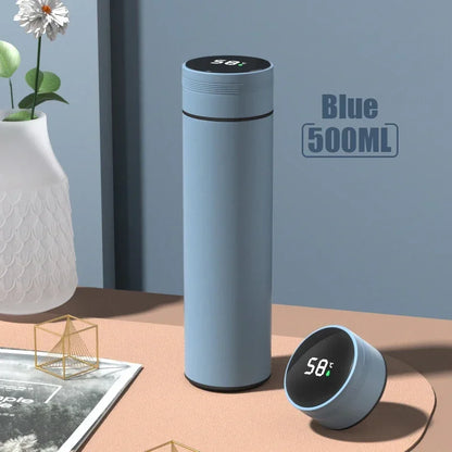 Blue 500ml thermos smart water bottle with digital temperature display showing 58°C, featuring a touch-activated lid and sleek insulated design.