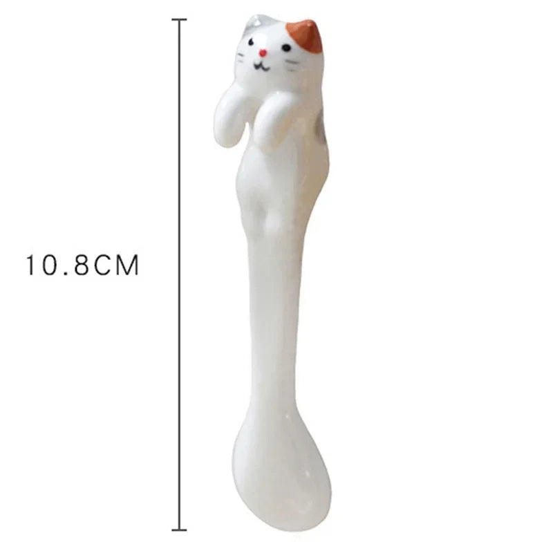 Dimension graphic showing 10.8 cm length of single cat‑handle coffee spoon—compact yet eye‑catching funny gifts accessory.

