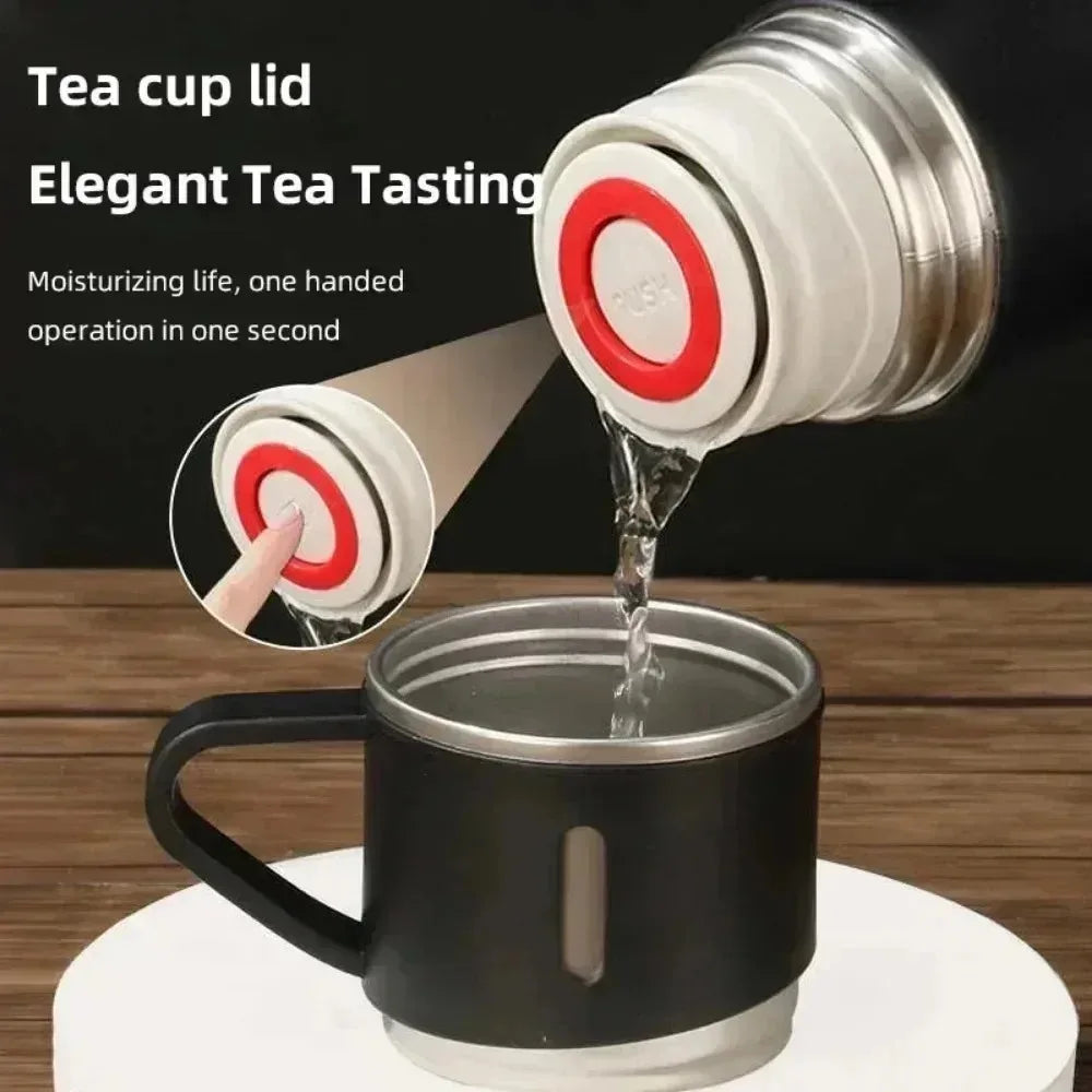 One‑hand pour of hot tea through push‑button seal into handled lid cup—thermos cup convenience with stainless tumbler cups.