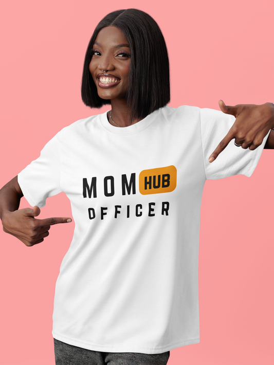 Confident woman pointing at white “Mom Hub Officer” design, a fun statement piece for mom shirts lovers.